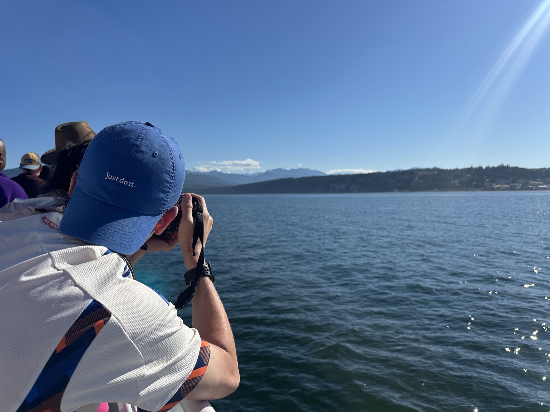 Photographer taking a photo from a boat